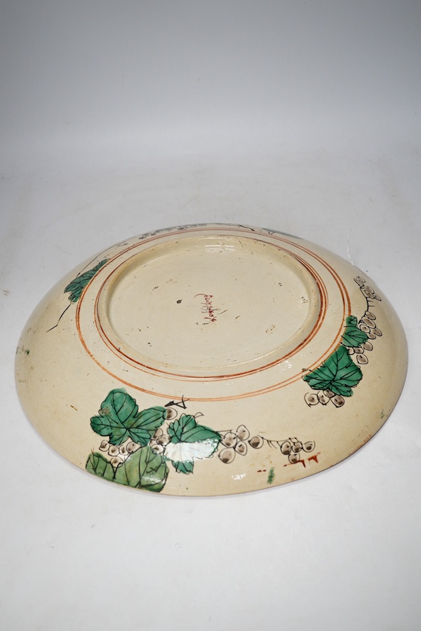 A Japanese Kutani earthenware charger, Meiji period, 36.5cm diameter. Condition - fair